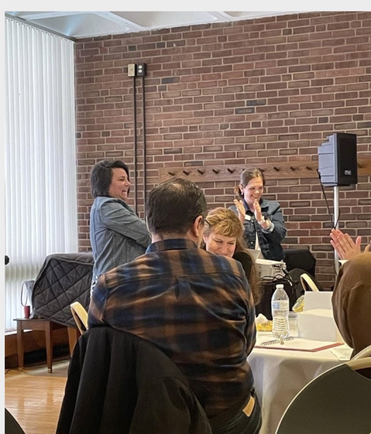 Dr. Victoria Verlezza laughing with participants during a workshop